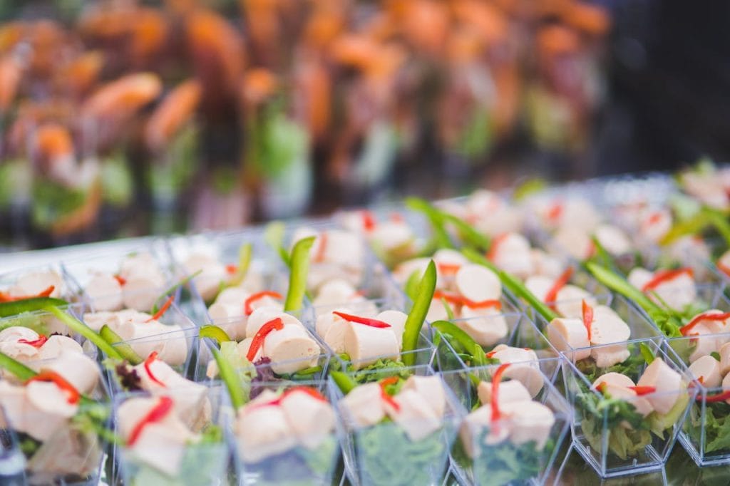 various-snacks-on-table-6589 Vibrant assortment of vegetarian appetizers in small serving cups, perfect for parties and events.